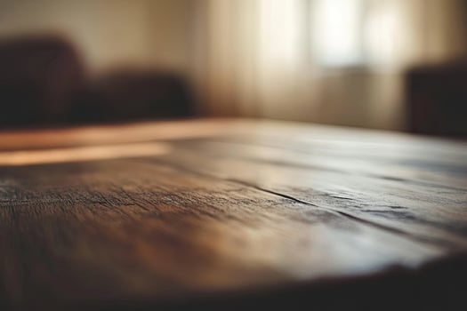 A wooden table with a blurry background photo