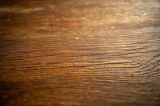A close up of a wooden table with a dark stain photo