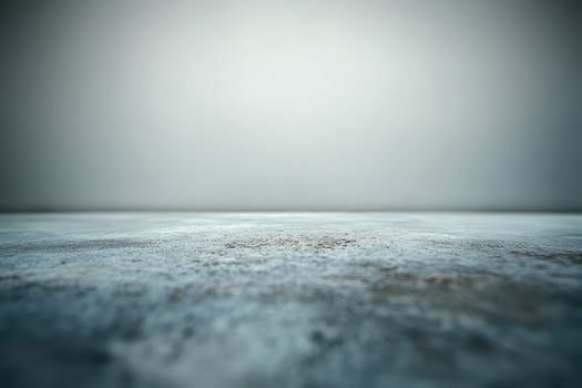 An empty concrete floor with a foggy sky photo