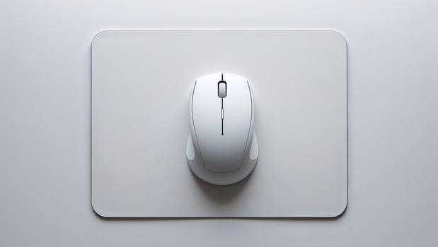 High-quality wireless mouse on a minimalist mouse pad in a modern workspace setup photo