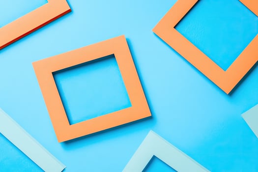 Colorful square frames on blue background photo