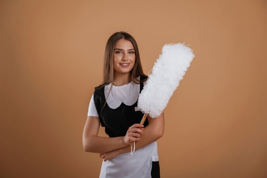 Occupation of,, chambermaid. Young pretty woman is against background in the studio photo
