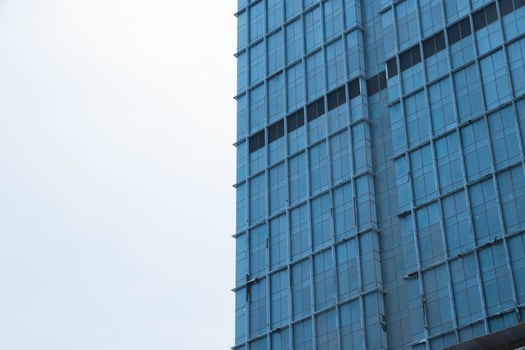 close-up transparent glass wall facades of modern buildings photo