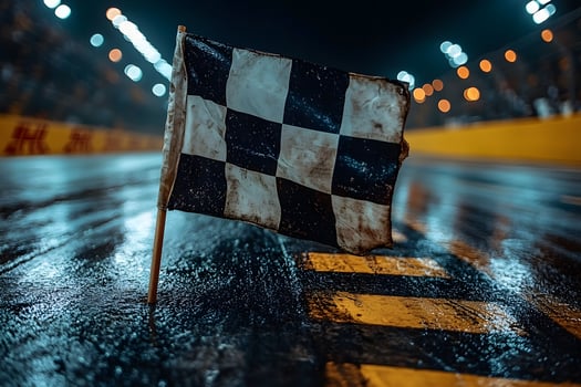 Nighttime Racing Event with Checkered Flag on Wet Track - Motorsport Victory Scene photo