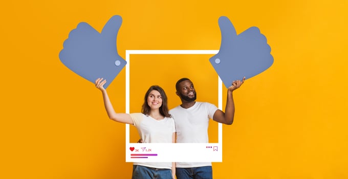 A man and woman joyfully pose with oversized thumbs up in front of a bright yellow background. They celebrate their success as influencers while promoting content creation and engagement. photo