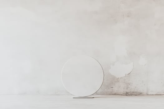 Minimalist circular mirror on a textured wall photo