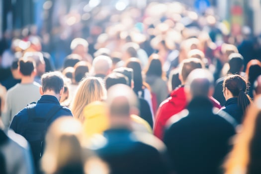 Crowded urban street with diverse people photo