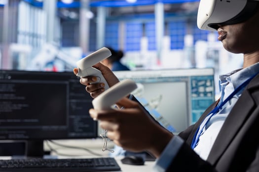 Woman in solar panel facility reviews photovoltaic system performance using VR goggles. African american employee analyzing production metrics using virtual reality tech to optimize efficiency photo