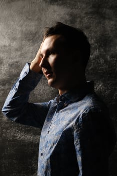 A Dramatic Portrait of a Young Man Captured in Stunning Artistic Lighting and Style photo