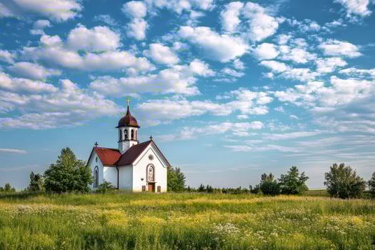 Charming church amid green fields and clouds photo
