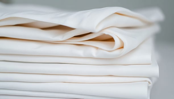 stack of white sheets folded on top of each other photo