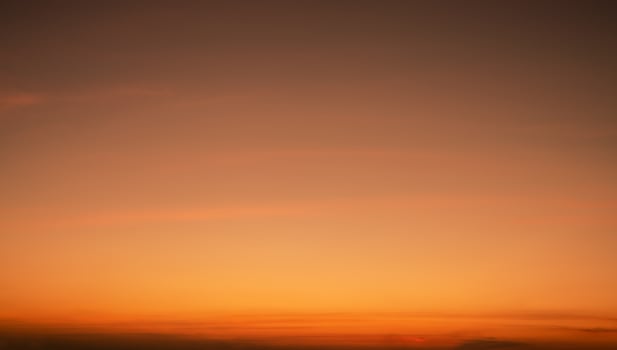 Calming orange sunset glows above peaceful horizon in summer. Peaceful sky at dusk create serene atmosphere for relaxation meditation background nature landscape scenic view summer evening tranquility photo
