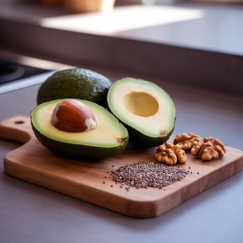 half-cut avocado with oil rosemary and seeds photo