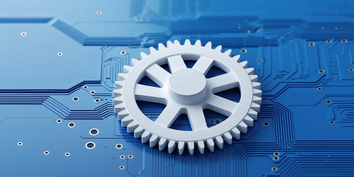 Mechanical gear placed on a blue circuit board illustrating technology and innovation in engineering photo