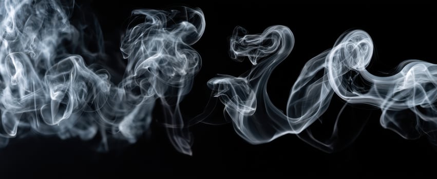 The Fluid Dance of Smoke Against a Dark Background photo