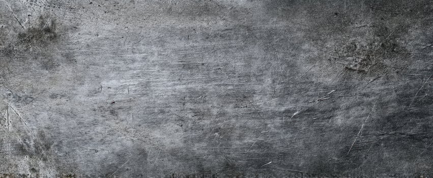 The textured gray metal surface with a weathered and industrial appearance. photo