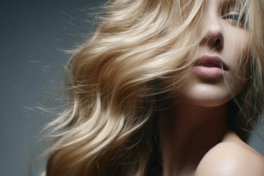 Stunning Blonde Woman with Flowing Hair A Captivating Portrait of Beauty and Elegance. This image showcases a models radiant skin photo