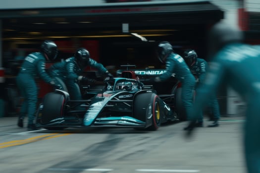 Formula 1 Pit Stop A Thrilling Display of Teamwork and Precision. The intense energy of the race unfolds as the team works in per photo