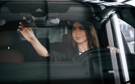 Testing, before buying. Beautiful,, businesswoman is in the new car photo