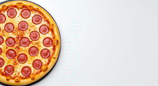 A pepperoni pizza on a white surface photo
