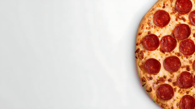 A pepperoni pizza is shown on a white surface for photoads photo