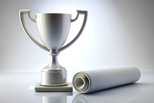 Stunning Silver Trophy and Scroll on Reflective Surface for Celebratory Themes or Achievements photo