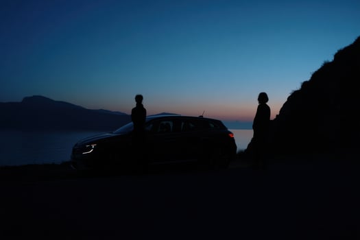 Serene Evening Road Trip A Couples Scenic Drive at Sunset, Enjoying the Breathtaking Ocean and Mountain Views. A Journey of Explor photo