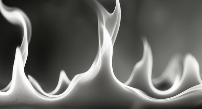A black and white photo of flames on a black background