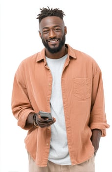 A Happy Man Smiling While Using His Mobile Phone. A Portrait of a Content African American Male in Casual Fashion, Set Against a photo
