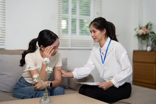 Psychologist and Patient. A psychologist providing emotional support to a distressed patient during a counseling session. photo