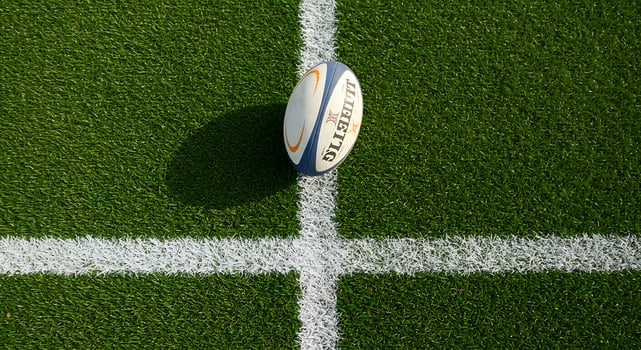 Rugby ball on grass field photo