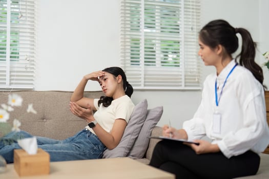 Psychologist and Patient. A psychologist engages with a patient during a therapy session focused on emotional well-being. photo