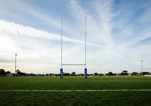 A rugby goal post on a field photo