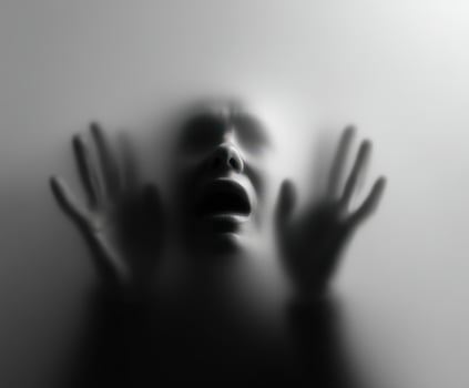 Expression of anguish in a foggy atmosphere captured in black and white photo