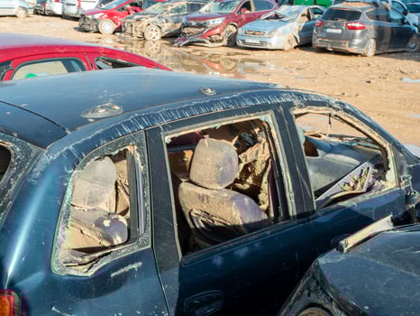 ruined, muddy vehicle captured after severe flood, representing vulnerability and environmental consequences of natural disasters photo