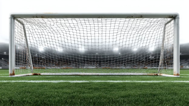 Soccer goal post in an empty stadium showcasing an exciting match atmosphere at dusk photo