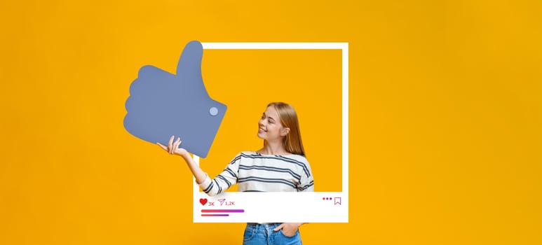 A young woman stands against a bright yellow background, smiling while holding a large thumbs up symbol. She embodies positivity, promoting her online content as an influencer. photo