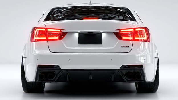 Sleek white sports car parked in modern indoor space with glowing taillights photo