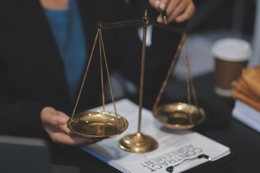 Businesswoman holding scales of justice photo