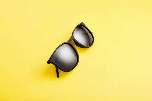 Sunglasses with black lenses, plastic spectacle frame. photo