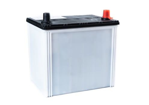 Single gray car battery isolated on white background. Compact automotive power unit designed for passenger vehicles. Ideal for catalog or online store. photo