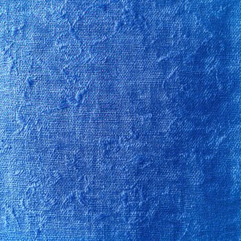 A blue painted canvas with a white background photo