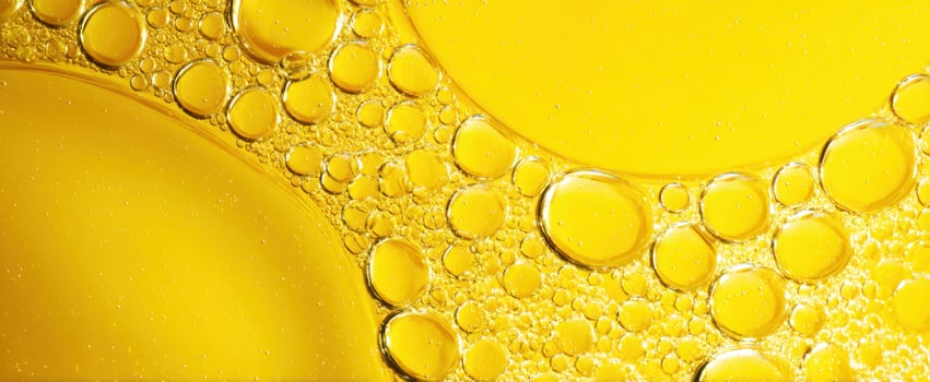 The mesmerizing beauty of yellow oil bubbles in close-up abstract art. photo