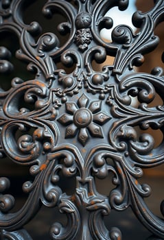 close up of a metal object with intricate designs photo