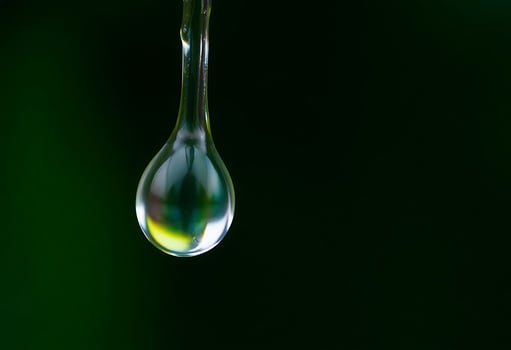 drop of water hanging from a pipe photo