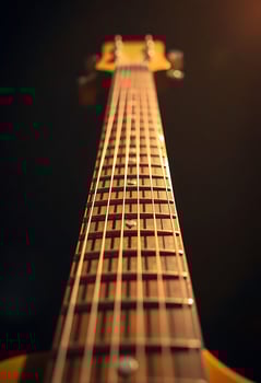close up of the neck of a guitar photo