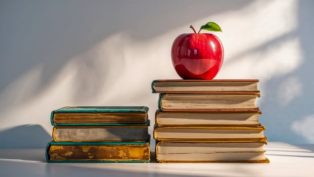 Fresh Red Apple on a Stack of Vintage Books in Bright Classroom Light for Educational and Knowledge Themes photo