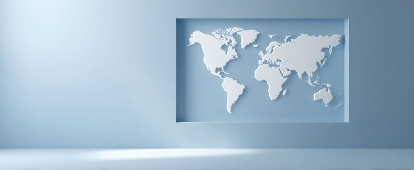 The modern world map displayed on a minimalist blue wall interior. photo