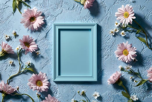 Light blue frame mockup surrounded by pink daisies on pastel blue background photo
