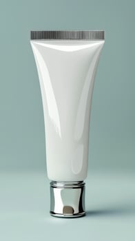 A white tube of cream on a blue background photo